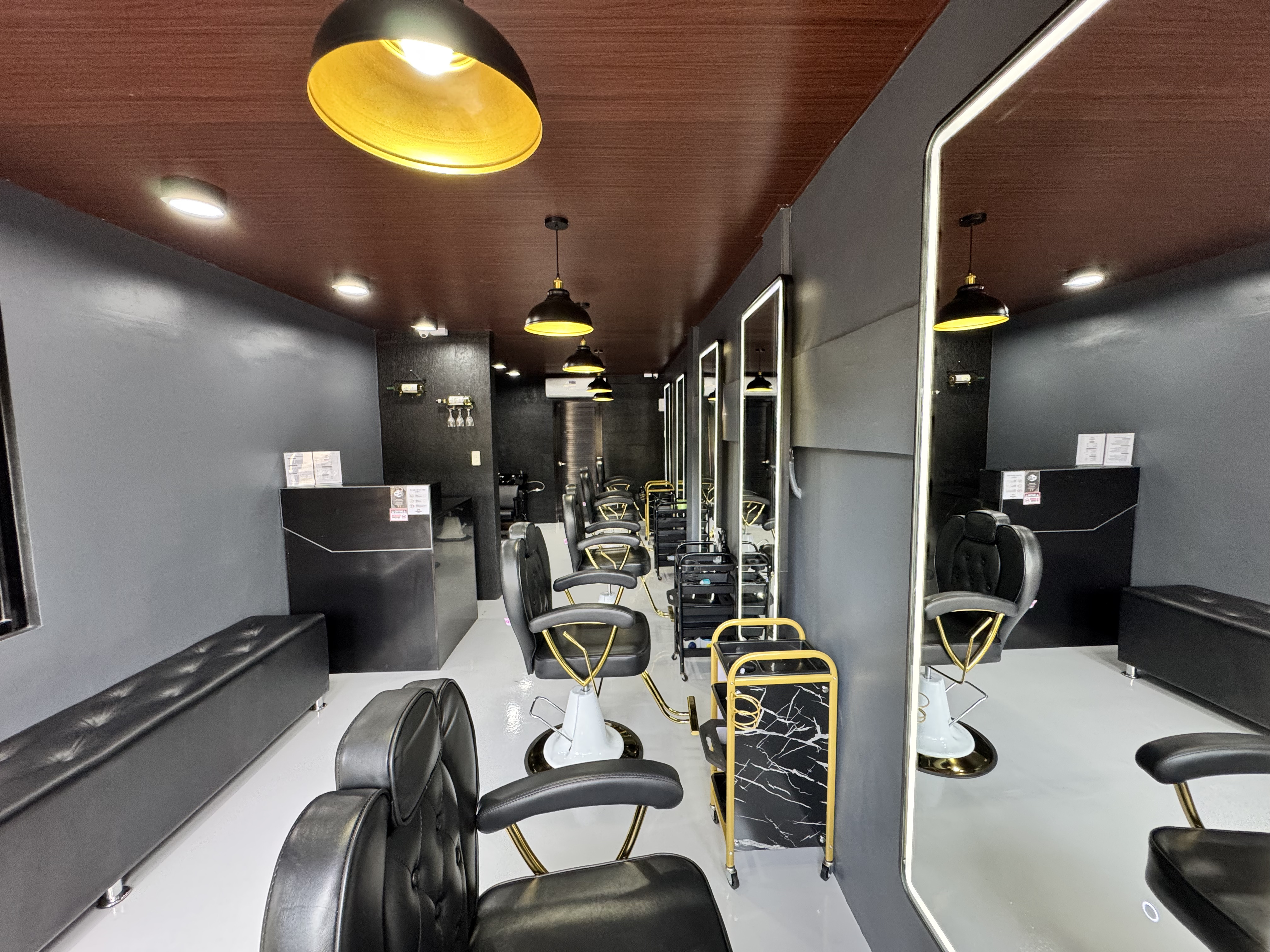 Barber working inside Jmampuag Grooming Studio